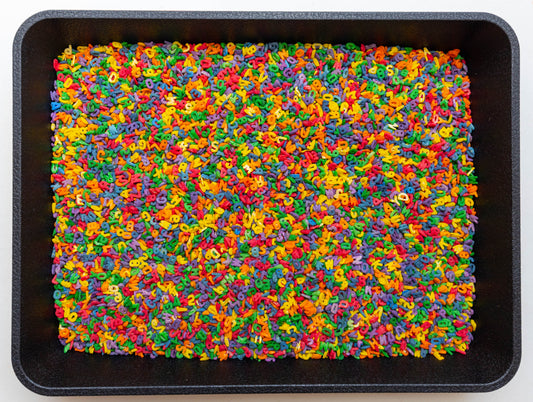 Alphabet Sensory Bin Filler for sensory play, preschool learning, fine motor skills, sensory table activities, and Montessori-inspired education.